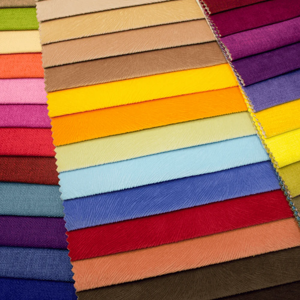 a collection of brightly coloured folded pieces of fabric